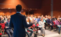 Speaker to an audience at annual meeting.jpg