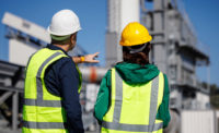 safety inspectors inspecting exterior of manufacturing facility