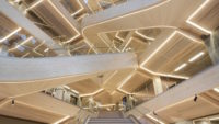 Picture of engineered wood on steps and ceiling of building