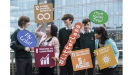 Children holding signs promoting sustainability