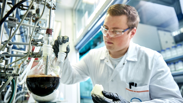 Photo of chemist in a lab researching chemical recycling
