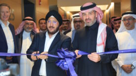 Photo of five men cutting a blue ribbon at the Nouryon Saudi Arabia Office Opening